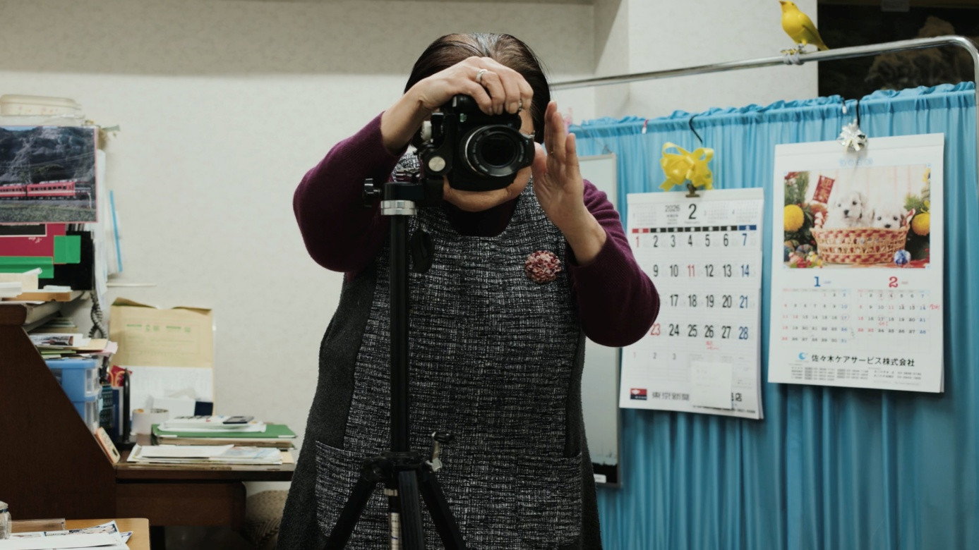 Masao Adachi Takes a Passport Photo