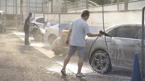 At a coin car wash after the rainy season